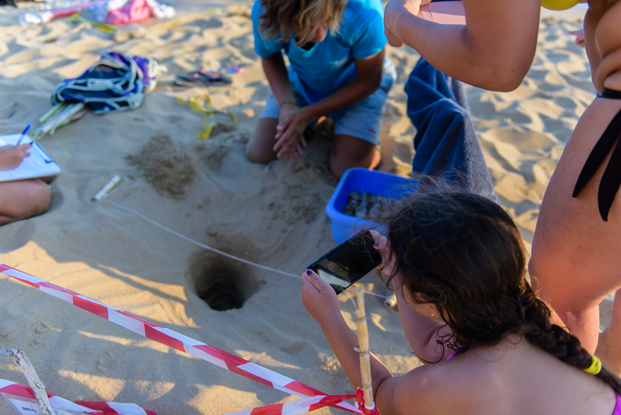 Visitors watching a loggerhead turtle nest excavation in Kefalonia